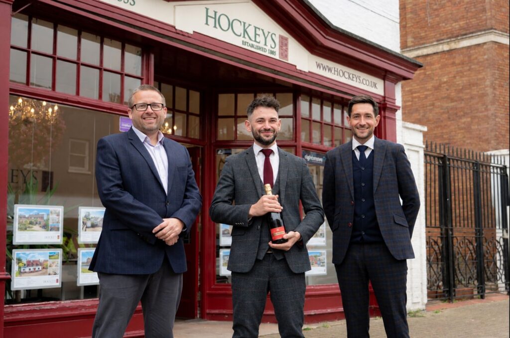 Dominic Clements with Daniel Sumner and Jeremy Trott following his promotion to Branch Manager at Hockeys Newmarket.